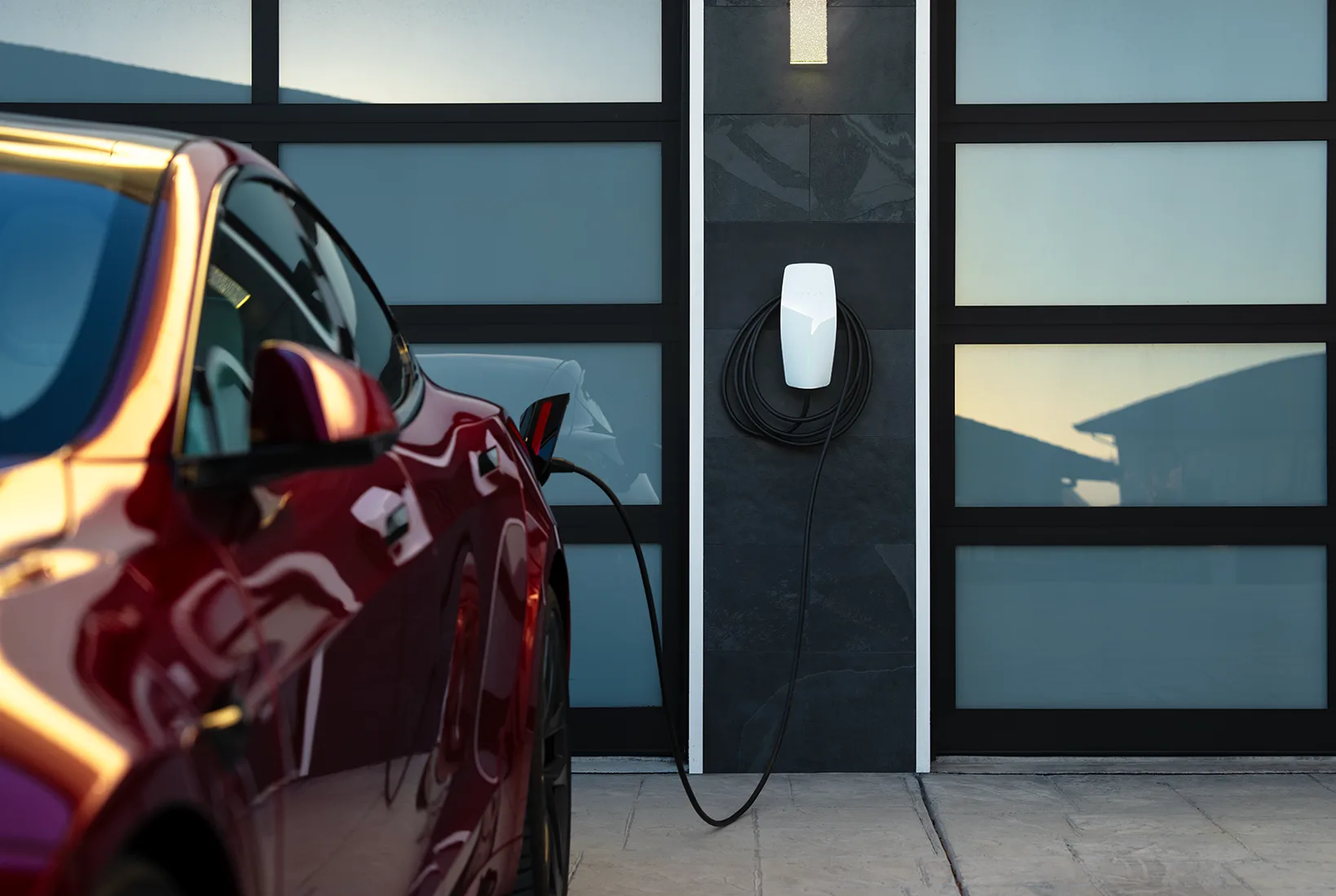 Electric vehicle charging at home with rooftop solar power.