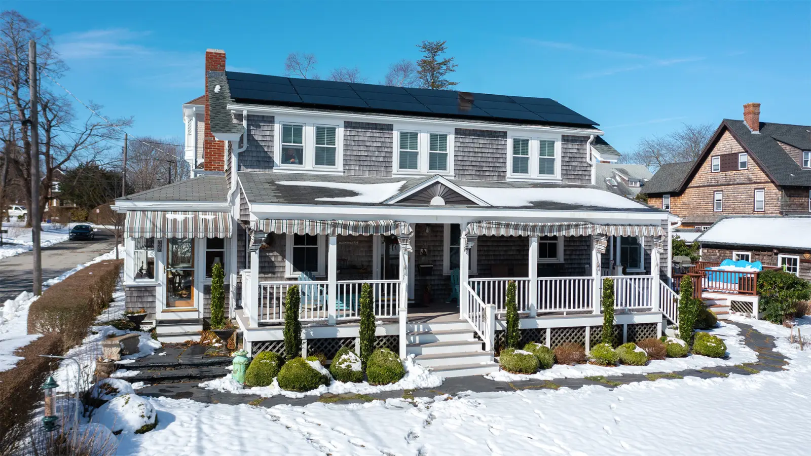 Aerial view of a completed Rooftop Power residential solar array on a Massachusetts home