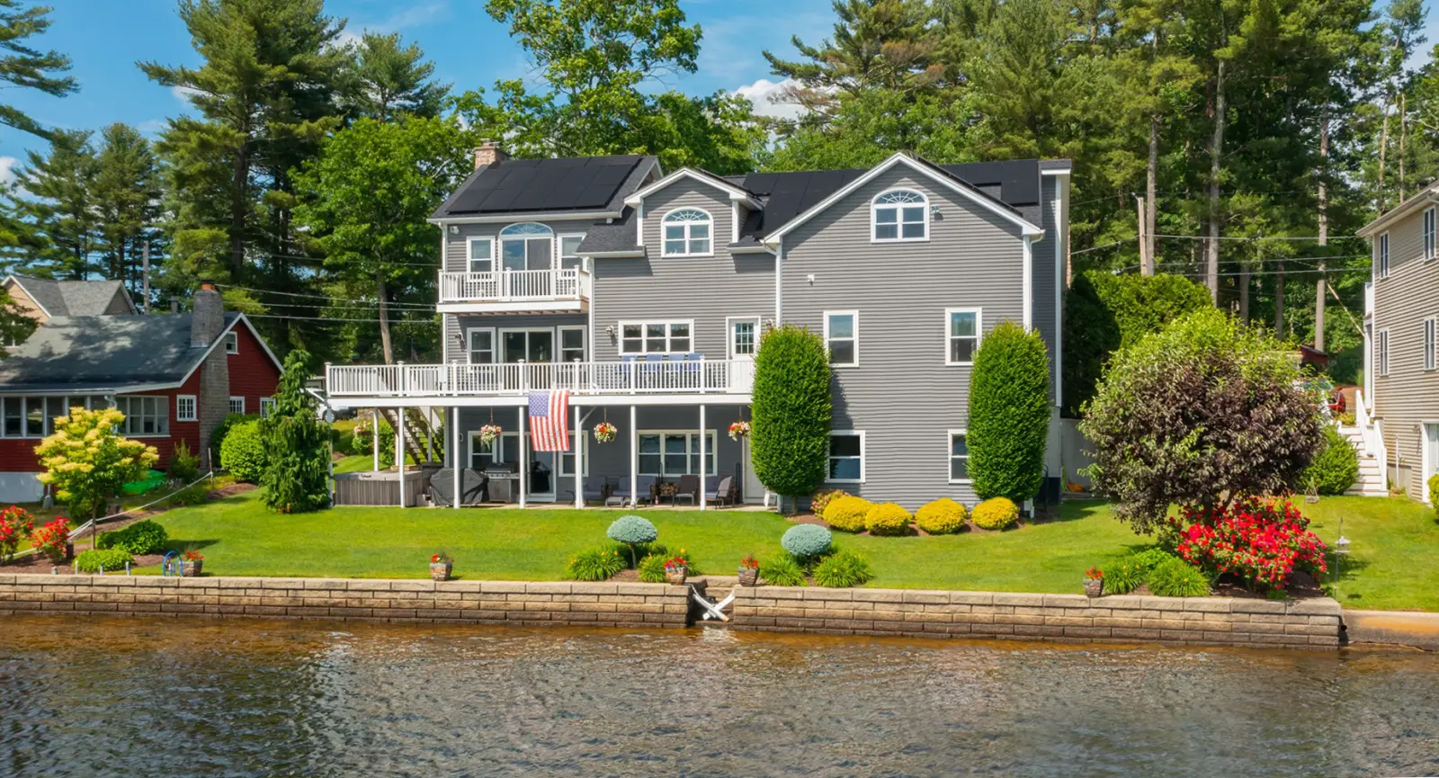 Connecticut home with solar panels and landscaping, illustrating renewable energy solutions and tax exemptions.