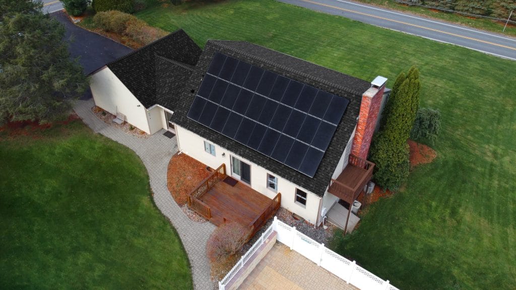 Solar panels on a New England home roof during a reroof project.