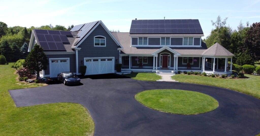 Solar panels on a New England home and potential solar tax credit savings.
