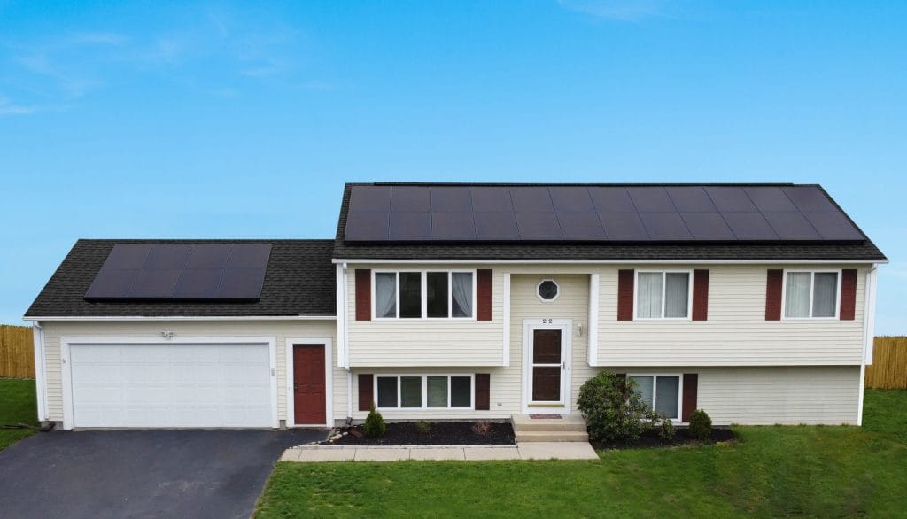 Home with solar panel installation by Rooftop Power, New England residential solar energy upgrade.